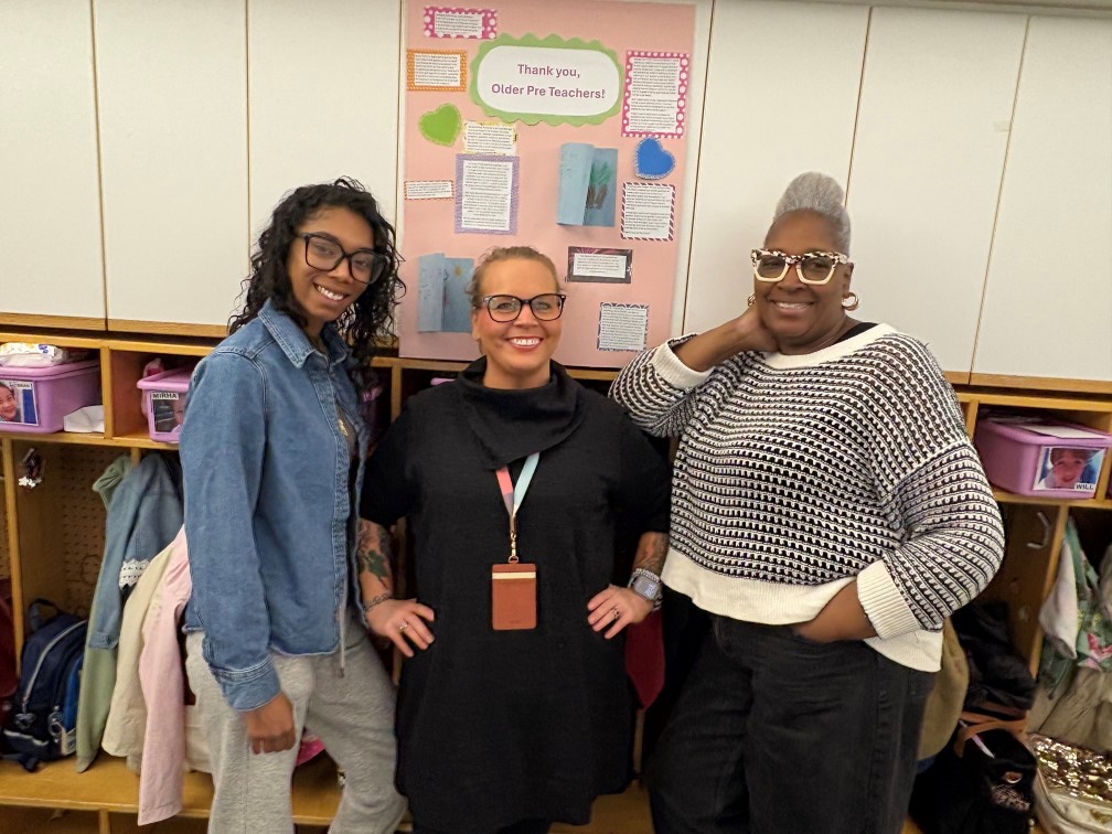 three teachers smile